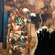 A ghostly self portrait of artist Emma Prempeh rests her hand on the shoulder of a grandmother she never met in this print and imitation gold leaf painting.